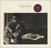 Paul Young - Between Two Fires (LP, Album) - Very Good Plus (VG+) / Very Good Plus (VG+)