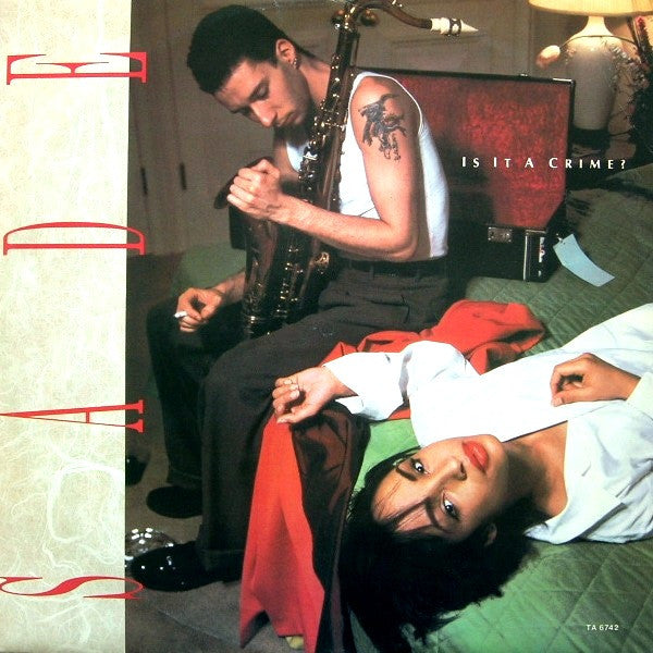 Release: Is It A Crime?-Vinyl-UK-1985-TA 6742-430753