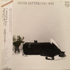 Seri Ishikawa - Never Letting Go (LP, Album) - Near Mint (NM or M-) / Very Good Plus (VG+)